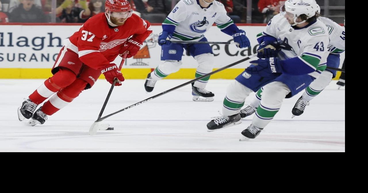 Jake DeBrusk scores hat trick, including OT game-winner, as Canucks top Red Wings 5-4