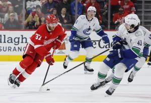 Jake DeBrusk scores hat trick, including OT game-winner, as Canucks top Red Wings 5-4