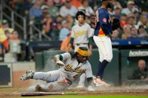 Muncy's solo homer caps off A's rally as Oakland beats Houston 7-6