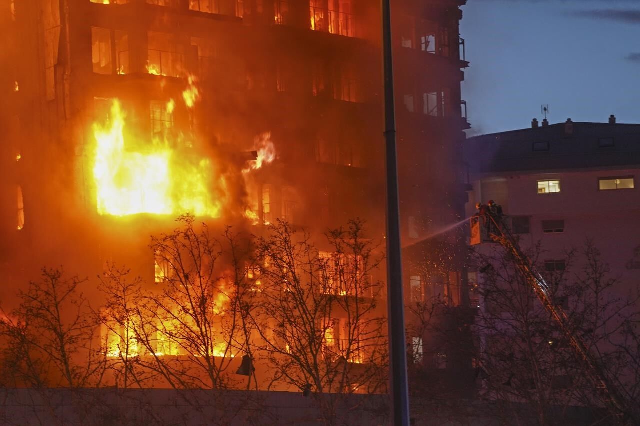 Fire engulfs 2 buildings in Spanish city of Valencia