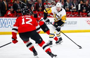 Malkin, Crosby and Letang help the Penguins beat the Devils to clinch a playoff spot