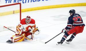 Wolf, Coleman lead Flames past Jets 3-1