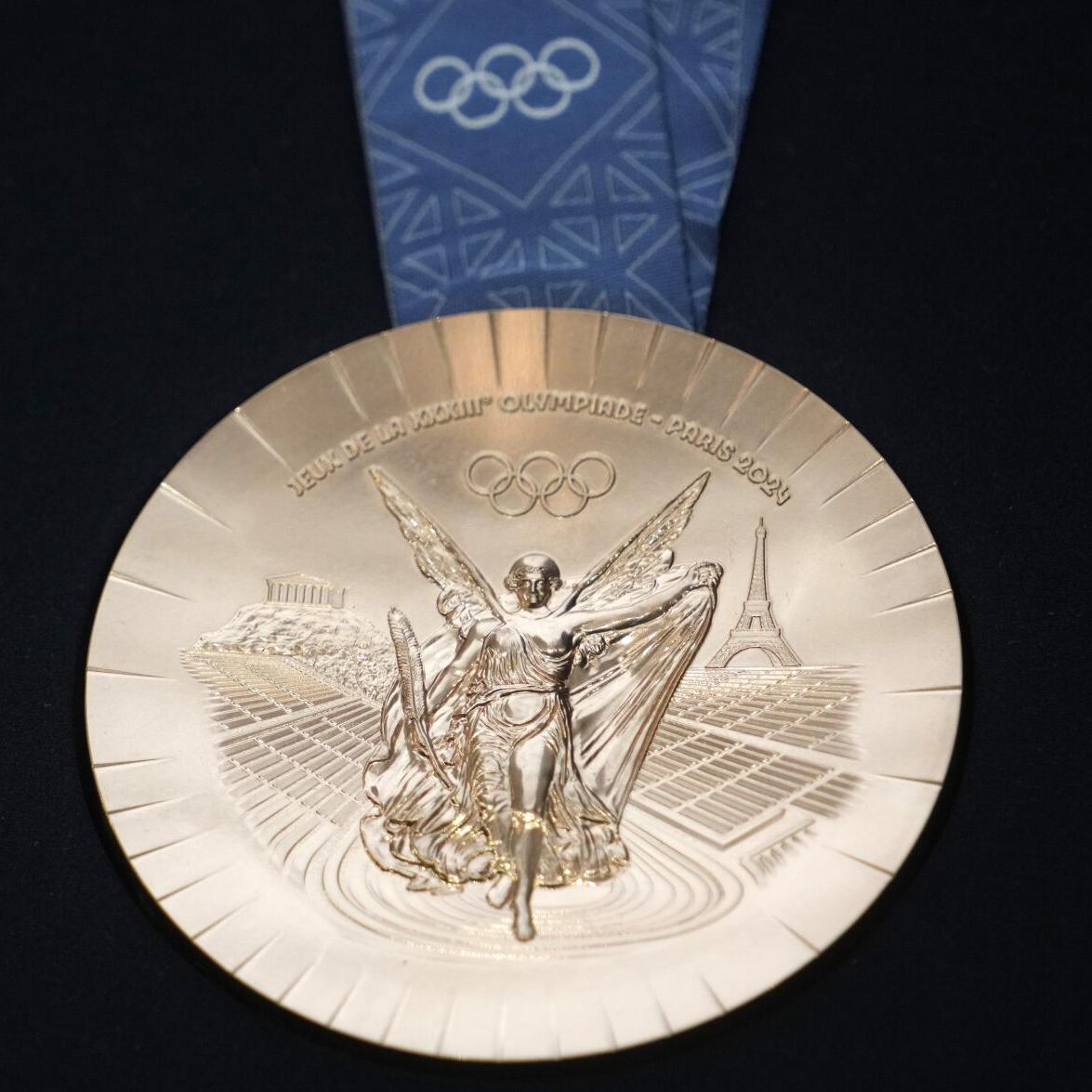 The Paris Olympics medals are monumental. They're embedded with pieces of the Eiffel Tower