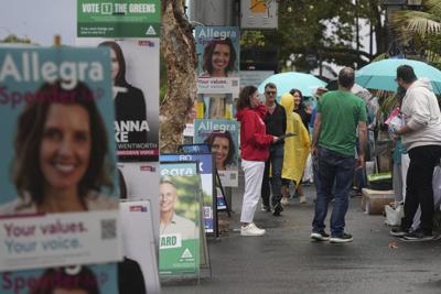 Australians start voting in general elections as pope's death overshadows campaigning