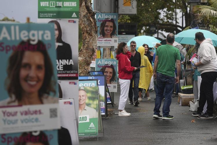 Australians start voting in general elections as pope's death overshadows campaigning