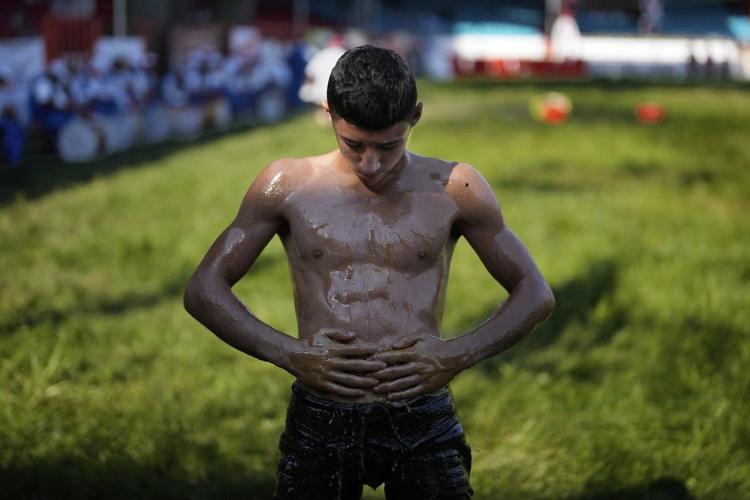 Photos show Turkey's youngest oil wrestlers keeping a 14th-century tradition alive