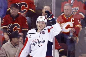 Flames burned by costly miscues against Capitals