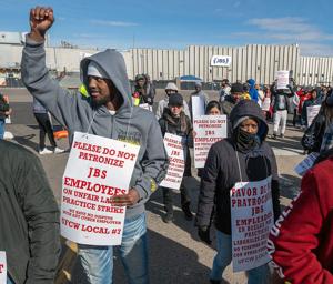 Workers plan to halt strike at major US meatpacking plant and resume negotiations
