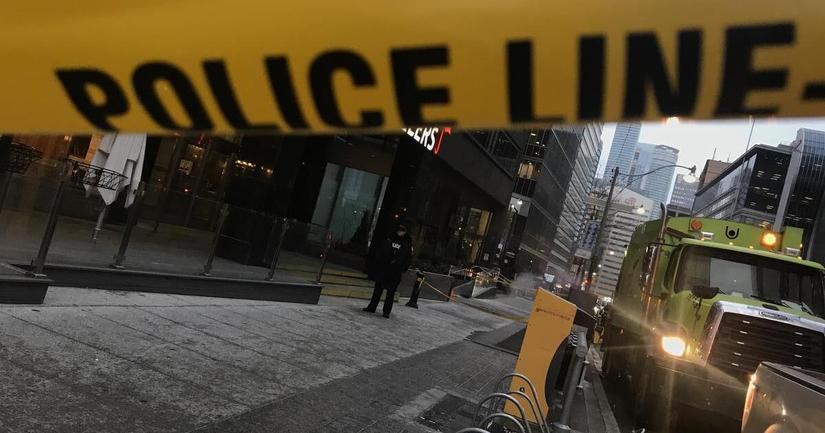 Woman dies after being hit by reversing garbage truck in downtown alleyway