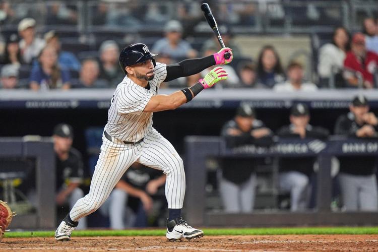 Yankees rally past White Sox 3-2, clinch playoff berth and close within 1 game of in AL East