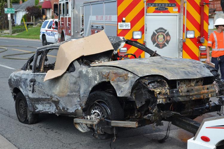 House bursts into flames after car crashes through wall