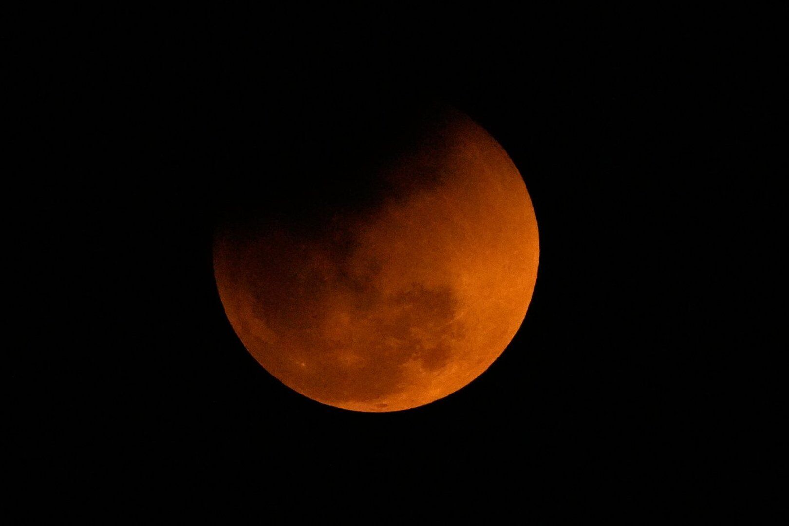 Photos of a blood-red moon and total lunar eclipse