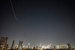 Iran targets Israel and Gulf Arab states even as Trump says US is in talks to end the war