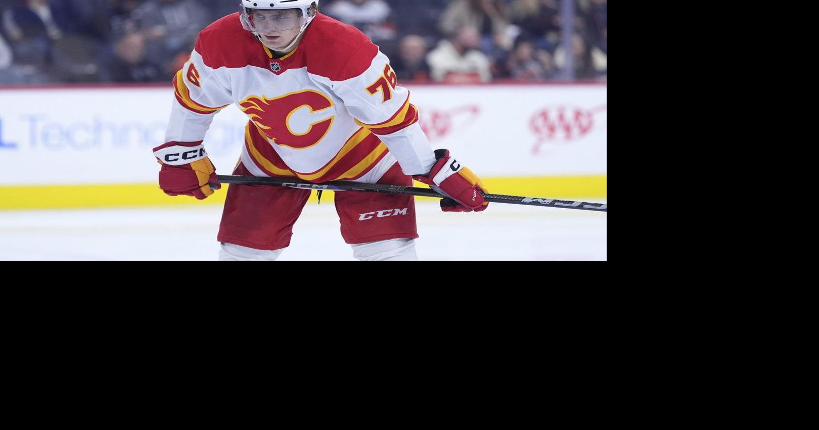 Pospisil’s heavy-hitting return a bright spot in Flames’ loss to Penguins
