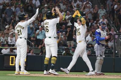 Rooker hits 2-run HR, Miller strikes out 2 with runner on 2nd in 9th as Athletics beat Blue Jays 4-3