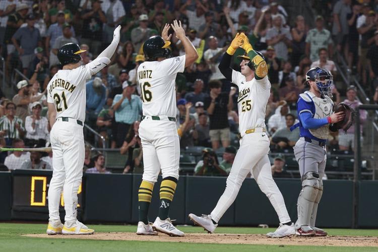 Rooker hits 2-run HR, Miller strikes out 2 with runner on 2nd in 9th as Athletics beat Blue Jays 4-3