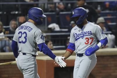 Hernández sends Dodgers past Mets 7-5 in 13 innings in wild and rainy NLCS rematch