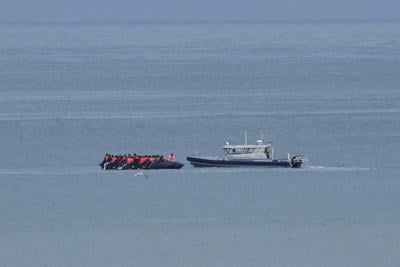 1 person dies when a boat overloaded with migrants sinks in the English Channel
