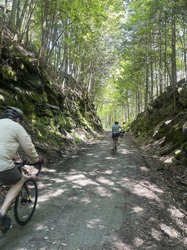 Hikers and cyclists can now cross Vermont on New England's longest rail trail, a year after floods
