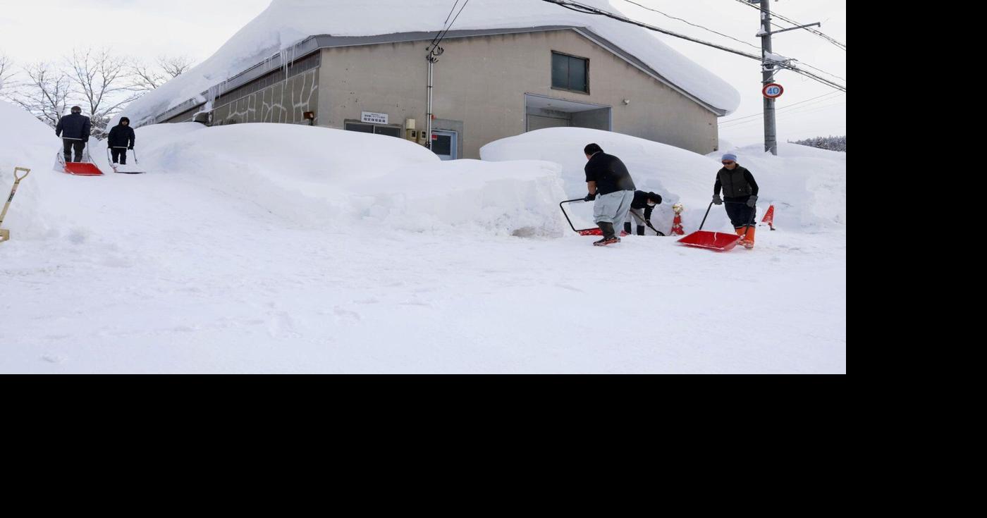 Heavy snow in northern Japan blocks roads and causes dozens of deaths