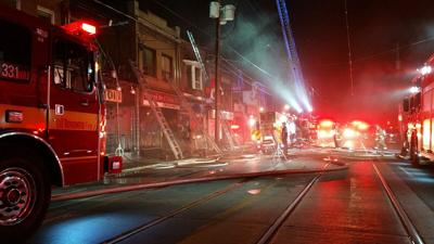Crews battle 4-alarm fire on Queen Street West, 1 firefighter