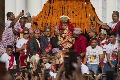 See Nepal's living goddess leave her palace to bless throngs of worshipers