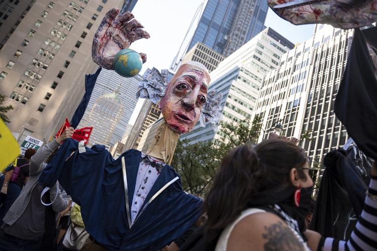 Photos show activists targeting billionaires in a street protest on the