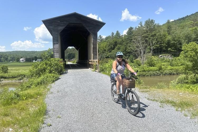 Hikers and cyclists can now cross Vermont on New England's longest rail trail, a year after floods
