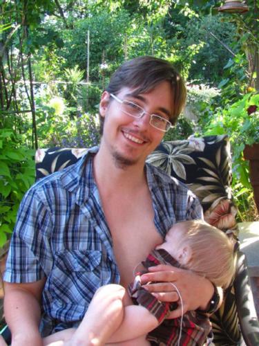 Young girl breast-feeding her baby, Asuncion, Paraguay, South