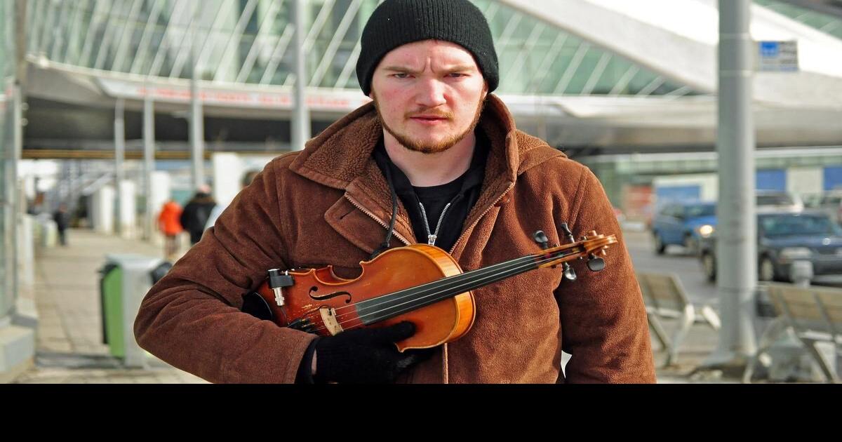 Edmonton busker claims he was unfairly arrested, roughed up and