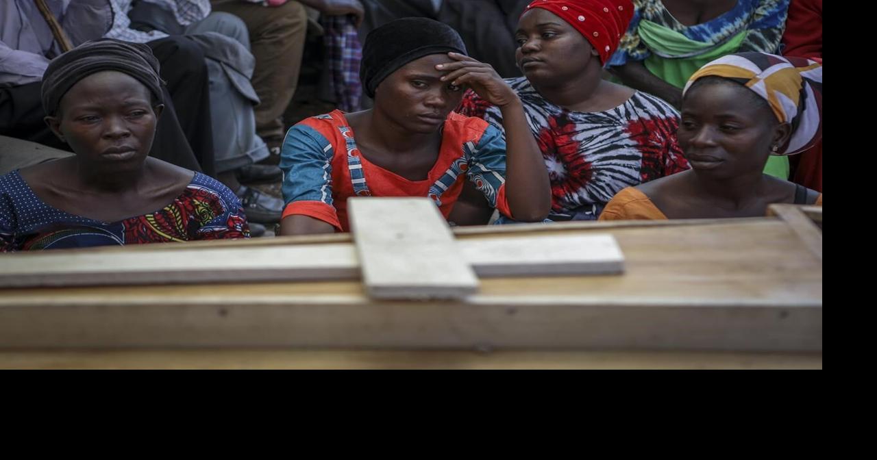 Ugandan border town buries victims of rebel massacre that left 42 dead