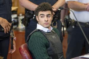 A heart-shaped note was found in socks bound for Luigi Mangione, prosecutors say