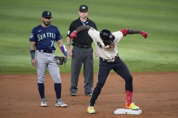 Rangers clinch postseason appearance after 6-2 victory over Mariners