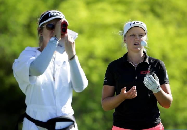 For Brooke Henderson and her sister-caddy Brittany, the golf course