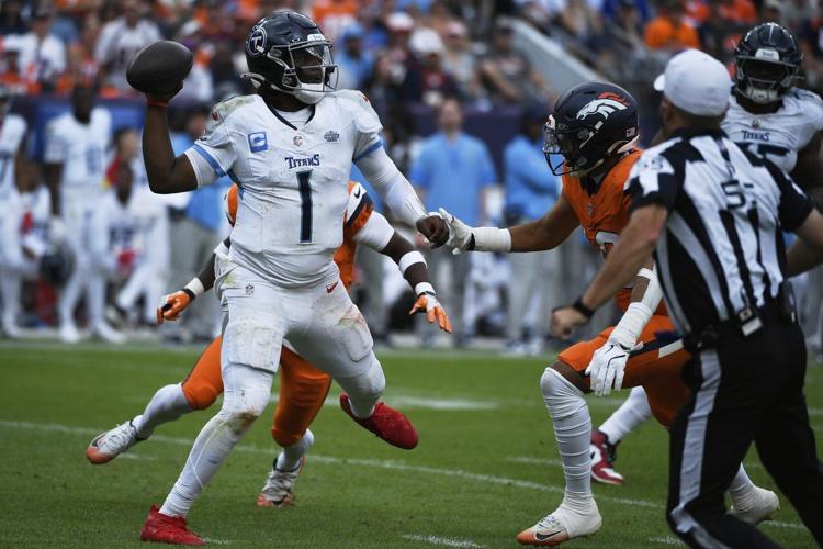 Denver #39 s defense swarms top overall draft pick as Titans #39 Cam Ward