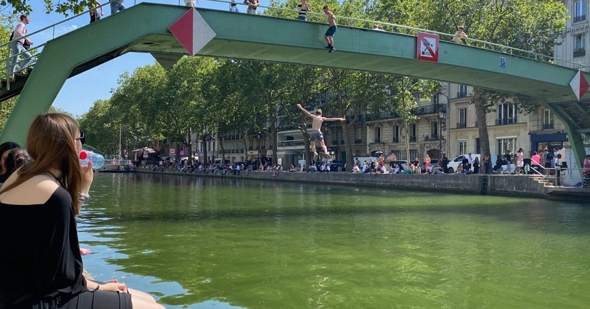Parisians weather their heat wave with canal dips and water guns