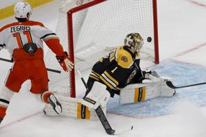 Ducks beat Bruins 3-2 in overtime for fourth straight win. Goalie Gibson leaves with injury