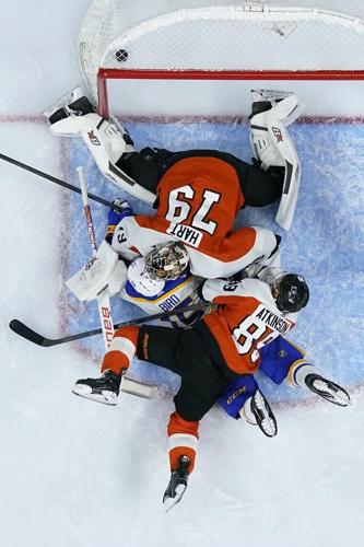 Goaltender Hart leaves Flyers game early with
