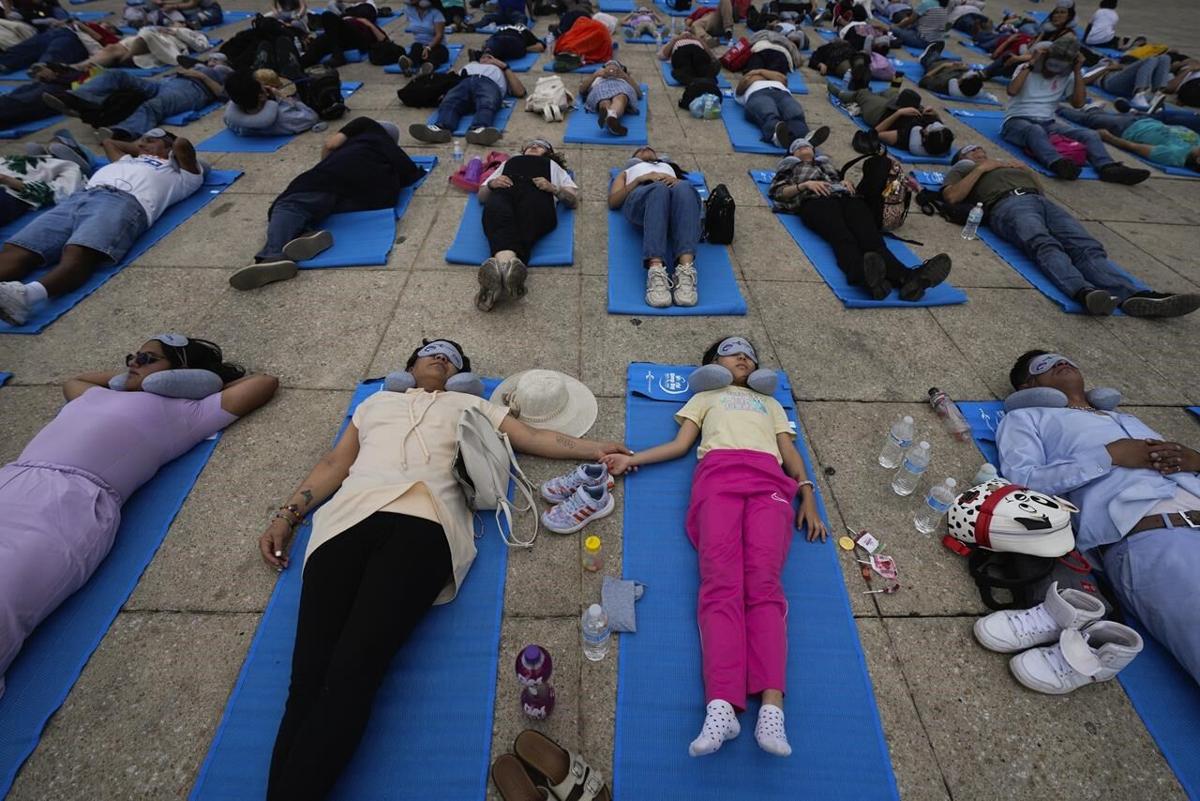 Hundreds of people in Mexico City stretch out for a 'mass nap' to  commemorate World Sleep Day