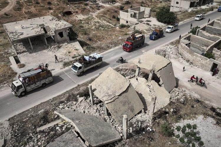 AP PHOTOS: Displaced Syrians Return Home
