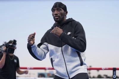 Boxing champ Terence Crawford tells Omaha graduates to work hard and keep fighting for success