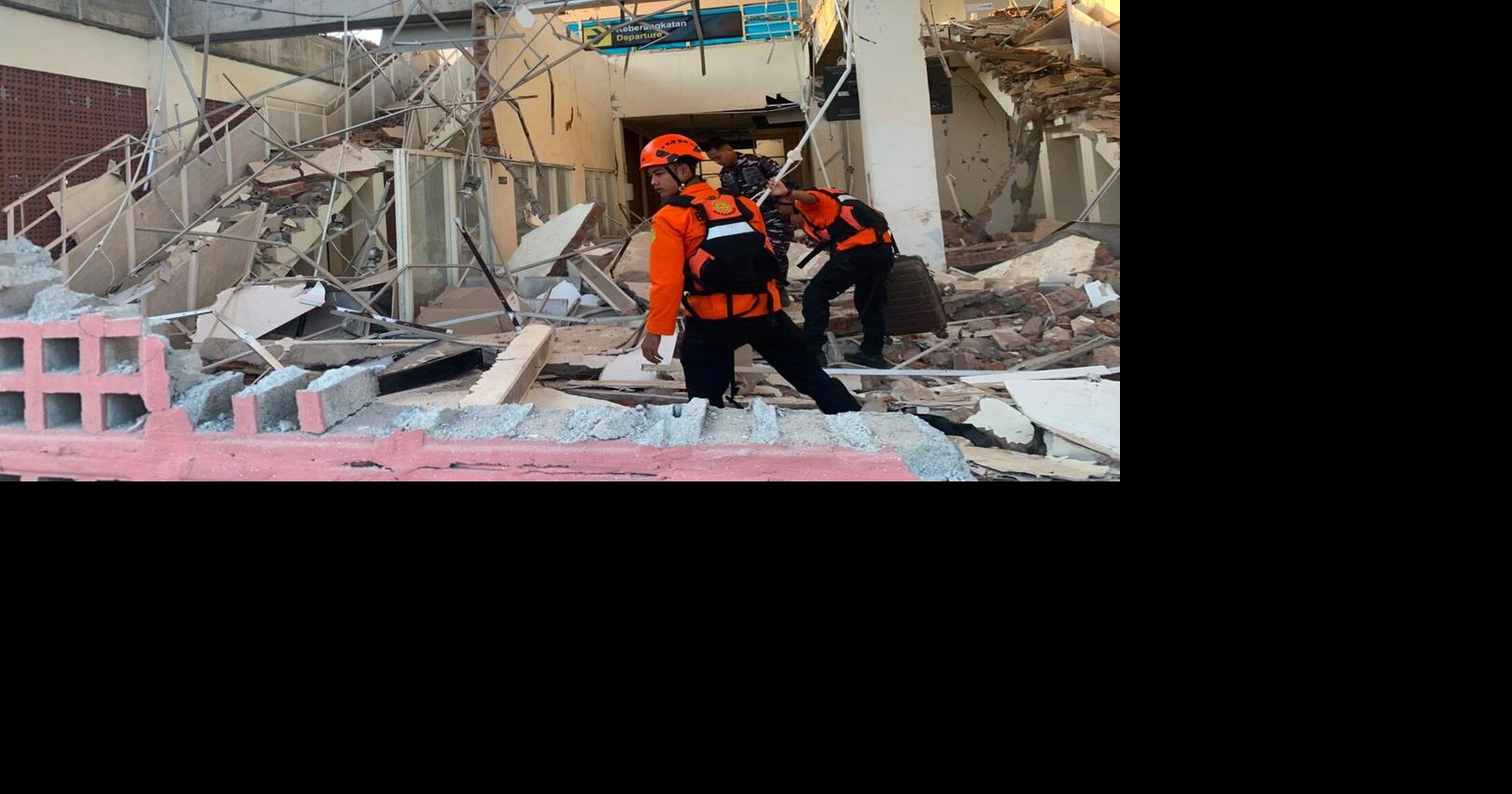 Rescuers dig through rubble and landslides after Indonesia quake kills 53