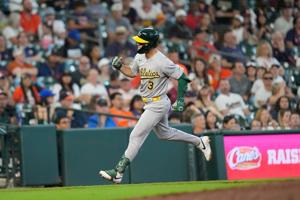 Muncy's solo homer caps off A's rally as Oakland beats Houston 7-6