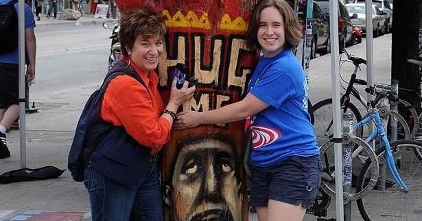 The Hug Me tree returns to its roots