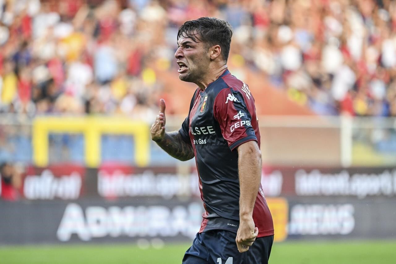 Late penalty sees Genoa hold defending Serie A champion Inter to 2 2 draw despite Thuram double