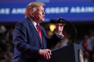 Trump interrupted by protesters as he fights to rally Texas voters behind Paxton in US Senate race