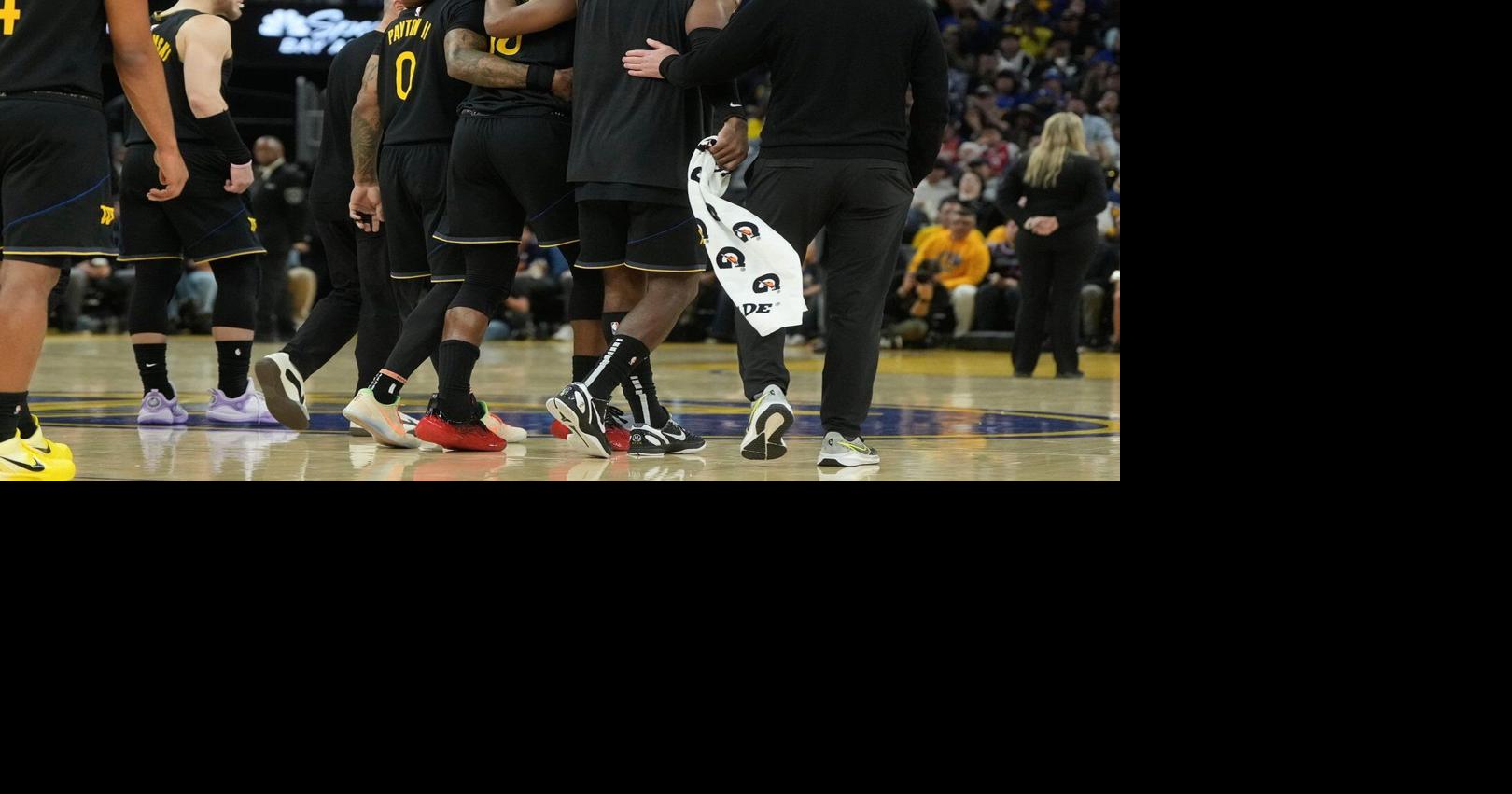 Warriors star Jimmy Butler goes down with right knee injury in win over Heat