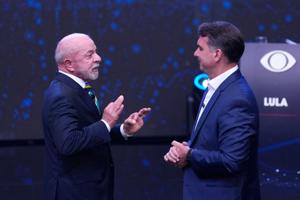 Brazil's Lula and Flávio Bolsonaro trade barbs in 1st debate only days before presidential runoff
