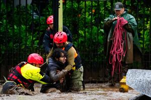 Heavy rain batters Chile’s capital, sweeping away cars and flooding homes