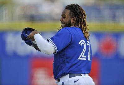 Vladimir Guerrero Jr. Autographed Photo - Blue Jersey (hitting